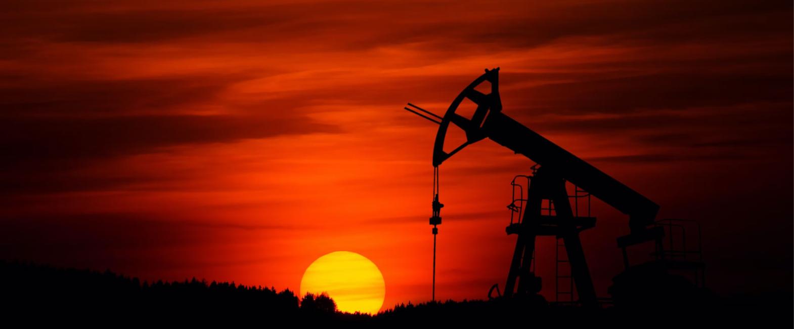 Oil Pump with a sunset in the background
